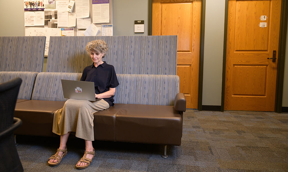 Lorna Rozelle working on laptop