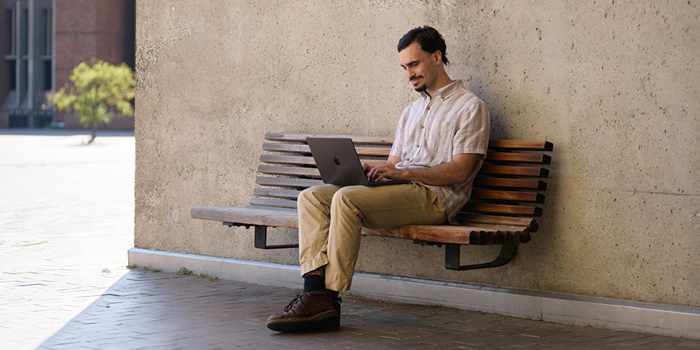 Guillermo Ruiz working on laptop